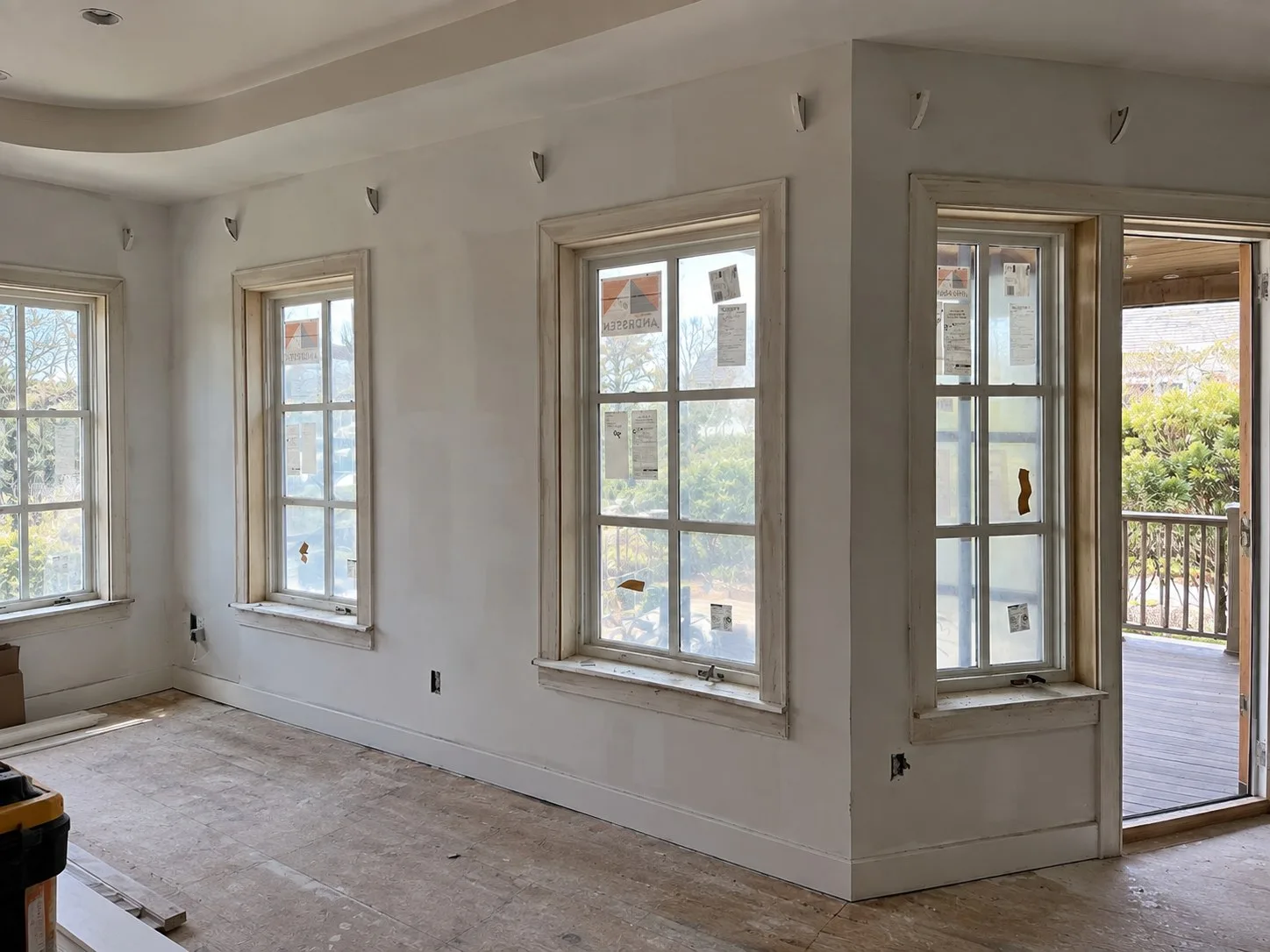 Room in bare drywall with unfinished window openings