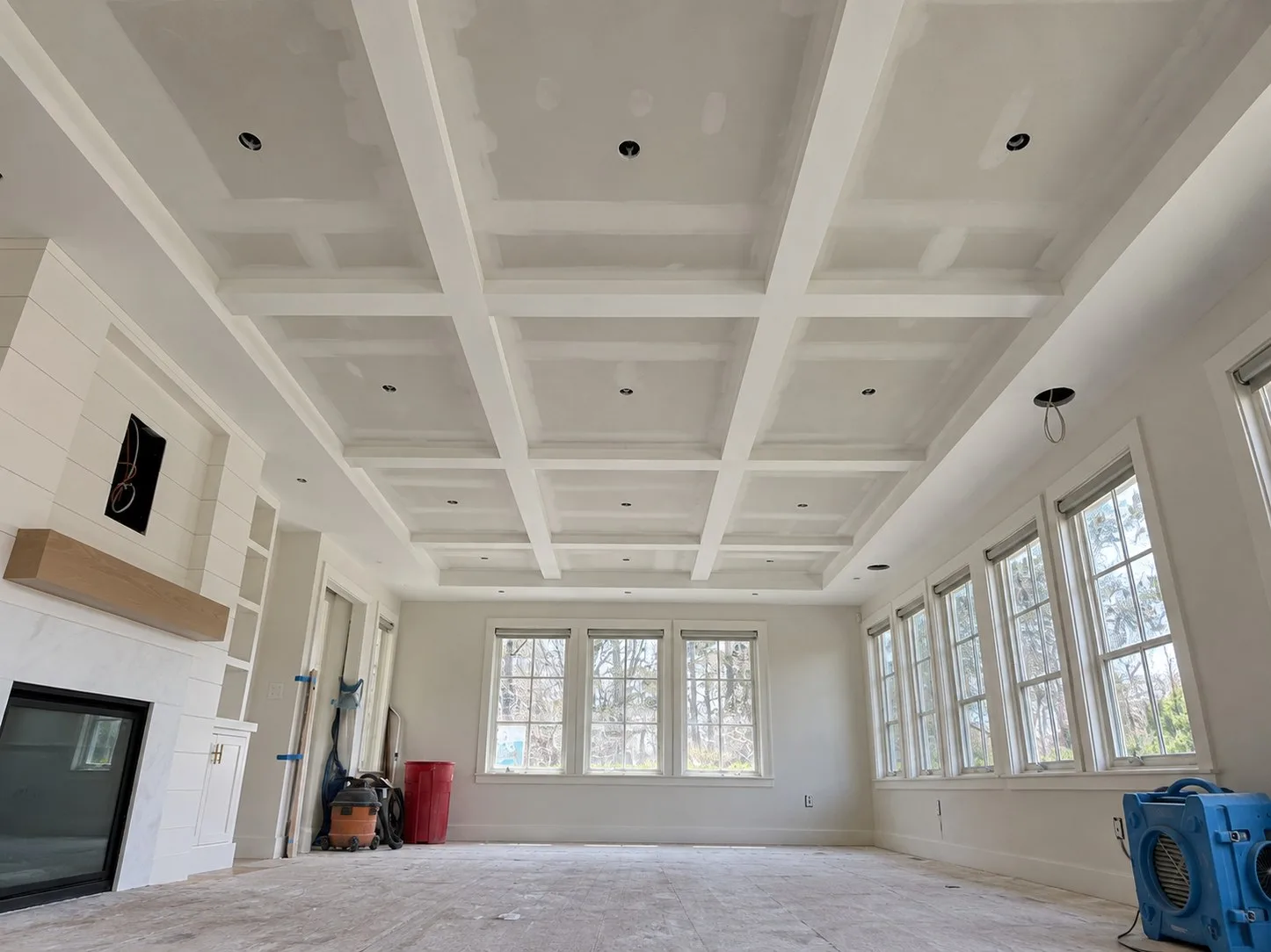 Coffered ceiling grid in primed drywall before the oak panels went in
